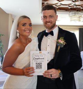 takenplace qr code for wedding pictures happy wedding couple holding QR code